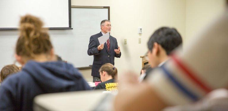 HSU Professor giving a lecture to a room full of students