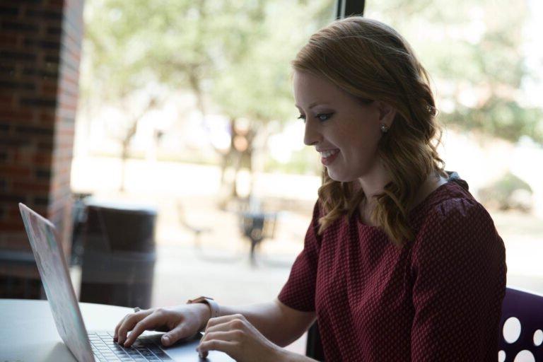 HSU Finance Program student working on her laptop